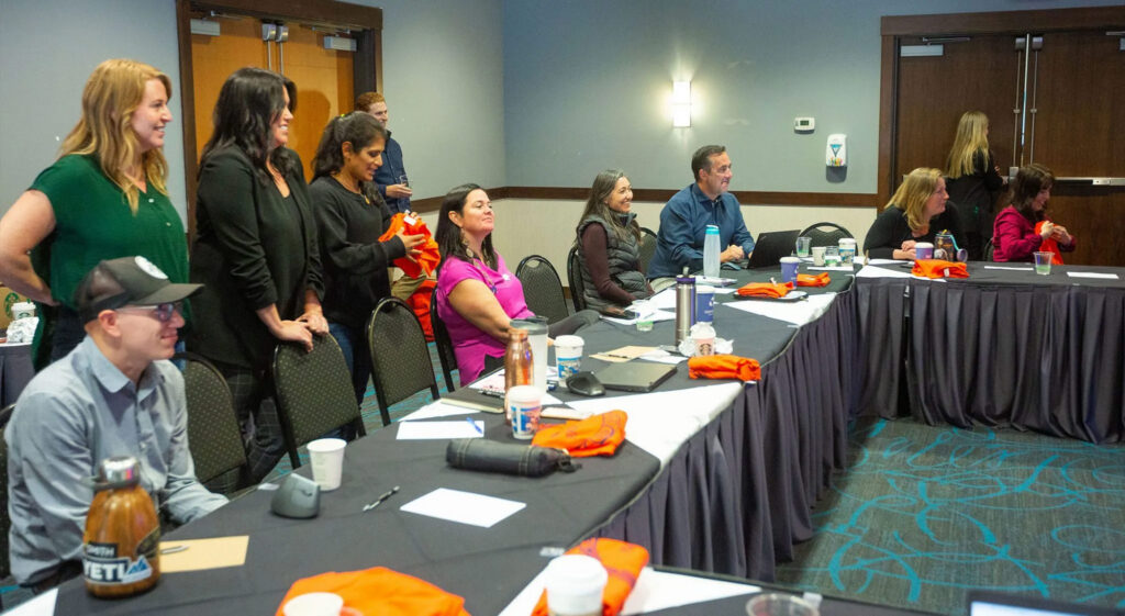 A group of Falkirk employees sitting around a table in a conference room